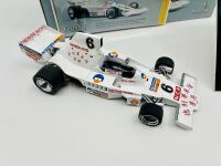 ALAN JONES: A 1:18 scale model by Classic Carlectables of the Lola T332 driven by Alan Jones, complete with certificate of authenticity and and original packaging together with an unwrapped group of photos mounted on card [Location: Sydney] - 2