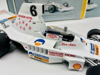 ALAN JONES: A 1:18 scale model by Classic Carlectables of the Lola T332 driven by Alan Jones, complete with certificate of authenticity and and original packaging together with an unwrapped group of photos mounted on card [Location: Sydney] - 5