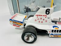 ALAN JONES: A 1:18 scale model by Classic Carlectables of the Lola T332 driven by Alan Jones, complete with certificate of authenticity and and original packaging together with an unwrapped group of photos mounted on card [Location: Sydney] - 6