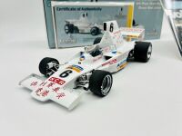 ALAN JONES: A 1:18 scale model by Classic Carlectables of the Lola T332 driven by Alan Jones, complete with certificate of authenticity and and original packaging together with an unwrapped group of photos mounted on card [Location: Sydney] - 7