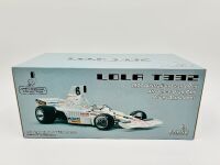 ALAN JONES: A 1:18 scale model by Classic Carlectables of the Lola T332 driven by Alan Jones, complete with certificate of authenticity and and original packaging together with an unwrapped group of photos mounted on card [Location: Sydney] - 9