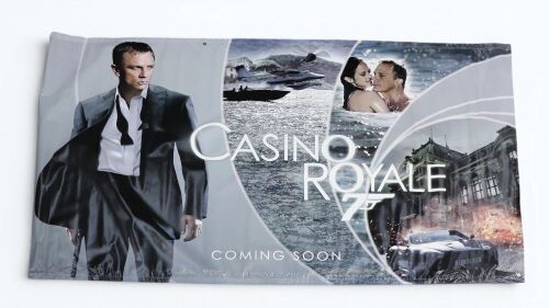 JAMES BOND: A large double-sided James Bond Casino Royale movie vinyl banner, measures 142cm high, 238cm wide