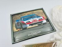 AMERICAN MOTORSPORT: A signed t-shirt by Geoff Brabham together with a framed photo of Paul Newman's 300ZX, an unframed photo of the Jones GTO Mustang and a poster [Location: Sydney] - 4
