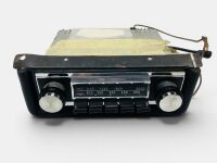 MOTOROLA MODEL 828 AM RADIO: A 1960s Motorola push-button AM radio with mounting plate