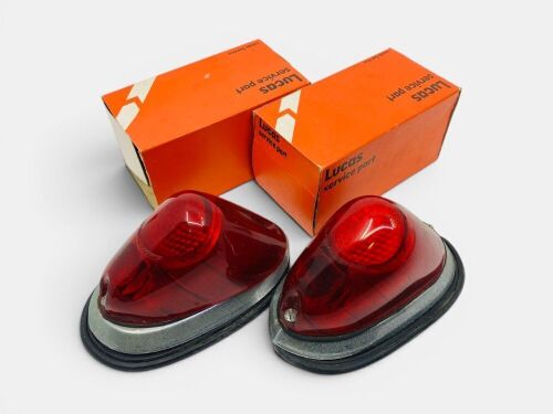 470 · TAIL LAMPS: A pair of Lucas L549 red tail lamps with chrome bezels