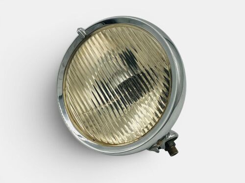 396 · HEADLAMP: A chrome headlamp, 23cm diameter, condition untested.