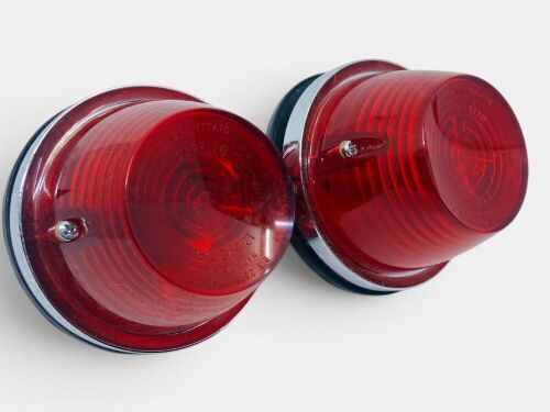 65 · TAIL LIGHTS: A pair of Carello tail lights with chrome bezels in original box