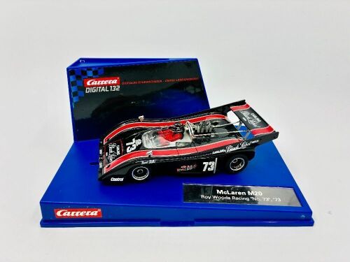 244 · MCLAREN: A 1:32 scale slot car by Carrera of the McLaren M20 with original display case [Location: Sydney]