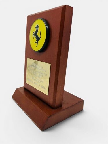 128 · FERRARI: A trophy mounted on a wooden plinth inscribed 'Australian Ferrari Register Autumn Supersprint 15 March 1992 Class 5 328/348 Runner-Up', 18cm high x 13cm wide