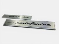 PININFARINA: A pair of badges 'Disegno di Pininfarina' with mounts, approx. 14.5cm wide x 2.3cm high