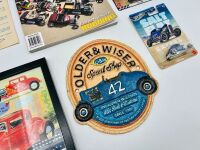 HOT RODS: Two National Hot Rod Show programmes together with a framed poster, an 'Older & Wiser Speed Shop' decorative plaque, two Hot Wheels models and Issue 13 of Hot Rodding International [Location: Sydney] - 6