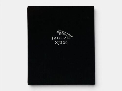 426 · JAGUAR XJ220: A hardcover book in slipcase by Phillip Porter.