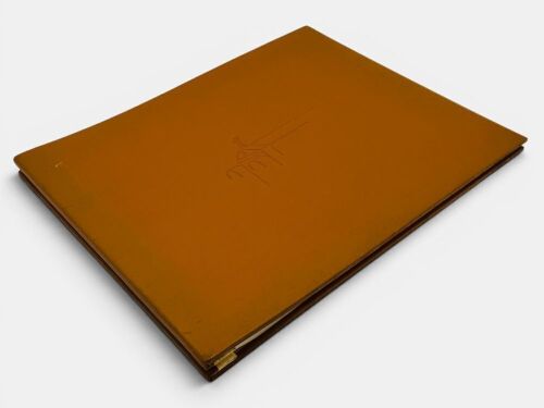ROLLS-ROYCE: A limited edition leather bound hardcover book entitled "The Spirit" featuring 24 prints by artist Ken Dallison, numbered 1230/2000.