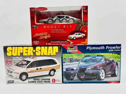 MODEL KITS: Three 1:24/1:25 scale model kits including a Dodge Caravan by Lindberg, a Ford Maverick Grabber by Motor Max and a Plymouth Prowler by Revell [Location: Sydney]