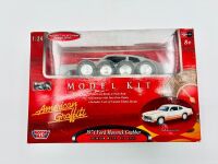 MODEL KITS: Three 1:24/1:25 scale model kits including a Dodge Caravan by Lindberg, a Ford Maverick Grabber by Motor Max and a Plymouth Prowler by Revell [Location: Sydney] - 4