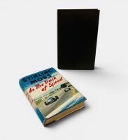STIRLING MOSS: A pair of hardcover books including "Stirling Moss: In the Track of Speed" and "A Turn at the Wheel"