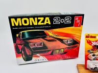 CHEVROLET MONZA: A 1:25 scale Chevrolet Monza model kit by AMT with a 1:64 scale Hot Wheels model [Location: Sydney] - 2
