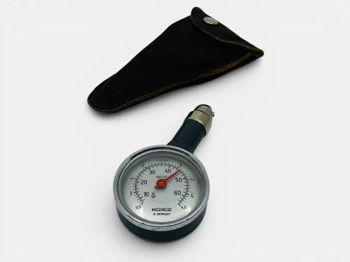 283 · TYRE PRESSURE GAUGE: A vintage 1960s MotoMeter tyre pressure gauge made in West Germany, in original leather pouch