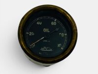 JAEGER OIL GAUGE: A British Jaeger oil pressure gauge, white markings on black face and brass bezel, 55mm diameter