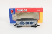 FREIGHT: Two HO scale model freight wagons, including SCT Logistics Broken Stripe w/Kadees and BHP Hopper Wagon - 4