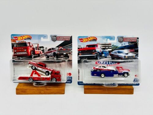 273 · HOT WHEELS: Two 1:64 scale Hot Wheels Premium Team Transport sets with original packaging [Location: Sydney]