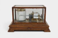 An early recording barometer barograph in brass with timber base and cut glass case, 23cm high, 38cm wide