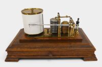 An early recording barometer barograph in brass with timber base and cut glass case, 23cm high, 38cm wide - 2