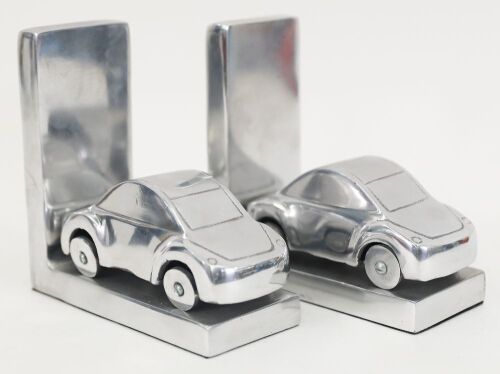 BOOKENDS: Two modern hollow metal book ends in the form of cars, 15.5cm high