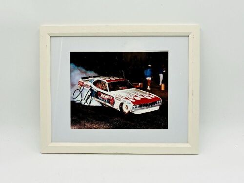 DON PRUDHOMME: A signed framed photo by Don "The Snake" Prudhomme featuring his Hot Wheels Dodge Funny Car [Location: Sydney]