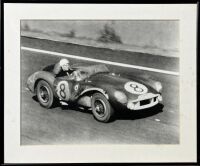ASTON MARTIN: A pair of framed black and white photographs showing the DB3/S finishing second at Le Mans in 1956 with Peter Collins and Stirling Moss co-driving, both signed by Stirling Moss, 60cm x 50cm - 4