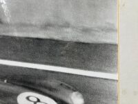 ASTON MARTIN: A pair of framed black and white photographs showing the DB3/S finishing second at Le Mans in 1956 with Peter Collins and Stirling Moss co-driving, both signed by Stirling Moss, 60cm x 50cm - 6