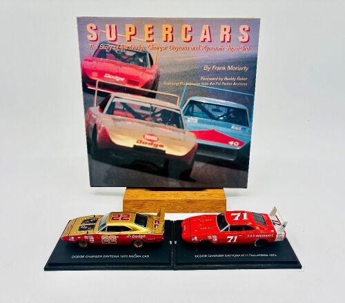 301 · DODGE DAYTONA: Two 1:43 scale models of the Dodge Daytona by Universal Hobbies, together with a hardcover book 'Supercars: The Story of the Dodge Charger Daytona and Plymouth Superbird' by Frank Moriarty [Location: Sydney]