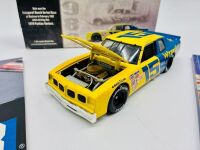 DALE EARNHARDT: A 1:24 scale model of Dale Earnhardt's 1979 Pontiac Ventura by Action Collectables together with an event programme and 'The 1984 Daytona 500 Yearbook' [Location: Sydney] - 4
