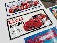 BILL ELLIOTT: Three Bill Elliott novelty licence plates together with a photo, a keyring and softcover book 'Ford, Lincoln & Mercury Stock Cars' by Dr. John Craft [Location: Sydney] - 2