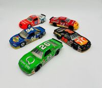 NASCAR: Five 1:24 scale 1990s Nascar models including two Ford Thunderbirds, a Chevrolet Lumina and an Oldsmobile Cutlass by Revell and a Chevrolet Monte Carlo by Racing Champions [Location: Sydney]