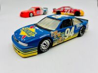 NASCAR: Five 1:24 scale 1990s Nascar models including two Ford Thunderbirds, a Chevrolet Lumina and an Oldsmobile Cutlass by Revell and a Chevrolet Monte Carlo by Racing Champions [Location: Sydney] - 2