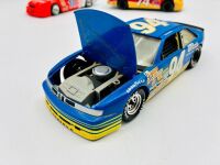 NASCAR: Five 1:24 scale 1990s Nascar models including two Ford Thunderbirds, a Chevrolet Lumina and an Oldsmobile Cutlass by Revell and a Chevrolet Monte Carlo by Racing Champions [Location: Sydney] - 3