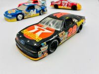 NASCAR: Five 1:24 scale 1990s Nascar models including two Ford Thunderbirds, a Chevrolet Lumina and an Oldsmobile Cutlass by Revell and a Chevrolet Monte Carlo by Racing Champions [Location: Sydney] - 5