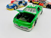 NASCAR: Five 1:24 scale 1990s Nascar models including two Ford Thunderbirds, a Chevrolet Lumina and an Oldsmobile Cutlass by Revell and a Chevrolet Monte Carlo by Racing Champions [Location: Sydney] - 14