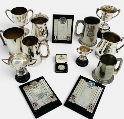 258 · TROPHIES: The Collins Family Trophy Collection, consisting of a large group of trophies and plaques awarded to former Ferrari Grand Prix driver Peter Collins and his father Pat Collins