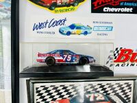 NASCAR: A group of Nascar items including two 1:43 scale models, two framed prints, a novelty licence plate, four unframed photos, seven stickers and four posters [Location: Sydney] - 2