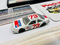 NASCAR: A group of Nascar items including two 1:43 scale models, two framed prints, a novelty licence plate, four unframed photos, seven stickers and four posters [Location: Sydney] - 4