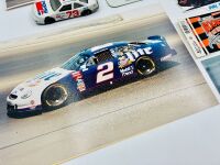 NASCAR: A group of Nascar items including two 1:43 scale models, two framed prints, a novelty licence plate, four unframed photos, seven stickers and four posters [Location: Sydney] - 5