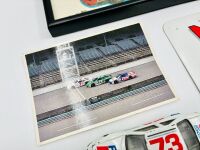 NASCAR: A group of Nascar items including two 1:43 scale models, two framed prints, a novelty licence plate, four unframed photos, seven stickers and four posters [Location: Sydney] - 9