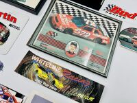 NASCAR: A group of Nascar items including two 1:43 scale models, two framed prints, a novelty licence plate, four unframed photos, seven stickers and four posters [Location: Sydney] - 11