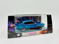 HOLDEN: A 1:24 scale Holden Torana by DDA Collectibles with original packing and a softcover book 'Holden: Monaro, Torana and Commodore in Competition' by Stewart Wilson [Location: Sydney] - 2