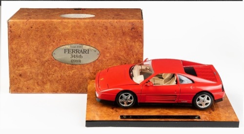 17 · FERRARI: A Bburago 1:18 scale 1989 Ferrari 348 tb model, special packaging on a heavy wooden plinth, product model number 3739