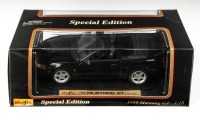 FORD: A Maisto 1:18 scale 1999 Ford Mustang GT convertible model, model number 31861