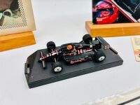 A.J. FOYT: Five A.J. Foyt Indycar items including a hardcover book, a media guide, a 1:43 scale model, a trading card and a poster [Location: Sydney] - 2