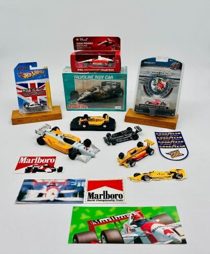337 · INDY CAR: Eight Indy Car models in various scales together four stickers [Location: Sydney]